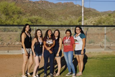 Members of the Senior League Girls Softball team pose for a picture.