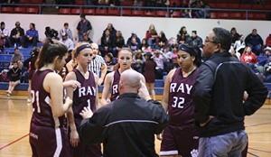 Head Coach Aaron Chenoweth gathers the Lady Cats for some instruction.JPG