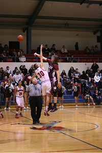 #30 Andy Monfred gets the jump ball against the Bearcats.JPG